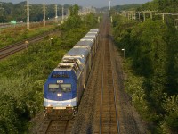 The second inbound run of the morning on the Vaudreuil-Hudson line is approaching Beaconsfield Station with AMT 1361 and six multilvel cars as it passes MP 11 of CP's Vaudreuil Sub.