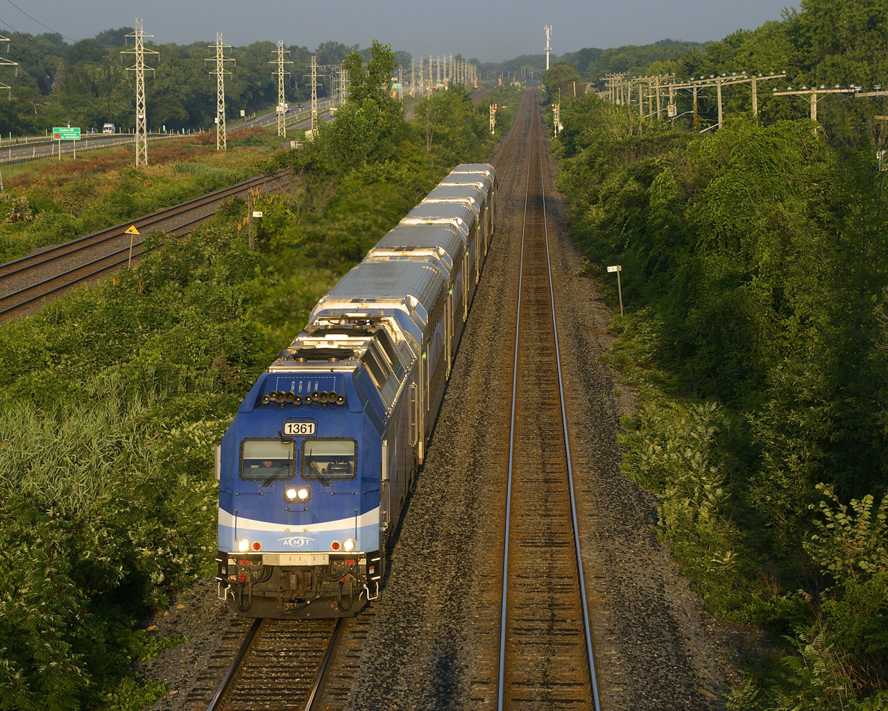 The second inbound run of the morning on the Vaudreuil-Hudson line is approaching Beaconsfield Station with AMT 1361 and six multilvel cars as it passes MP 11 of CP's Vaudreuil Sub.