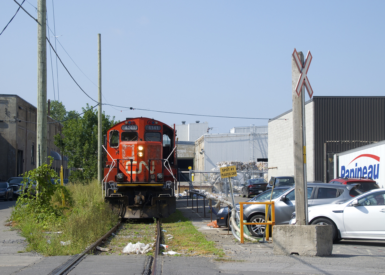 The Pointe St-Charles Switcher is shoving a single boxcar towards Kruger, located at the end of the Turcot Holding Spur. To the right of CN 4141 is a sign that says "Spot #1 Plastic Car". There is a second client (Imaflex) who occasionally receives a car at that location.