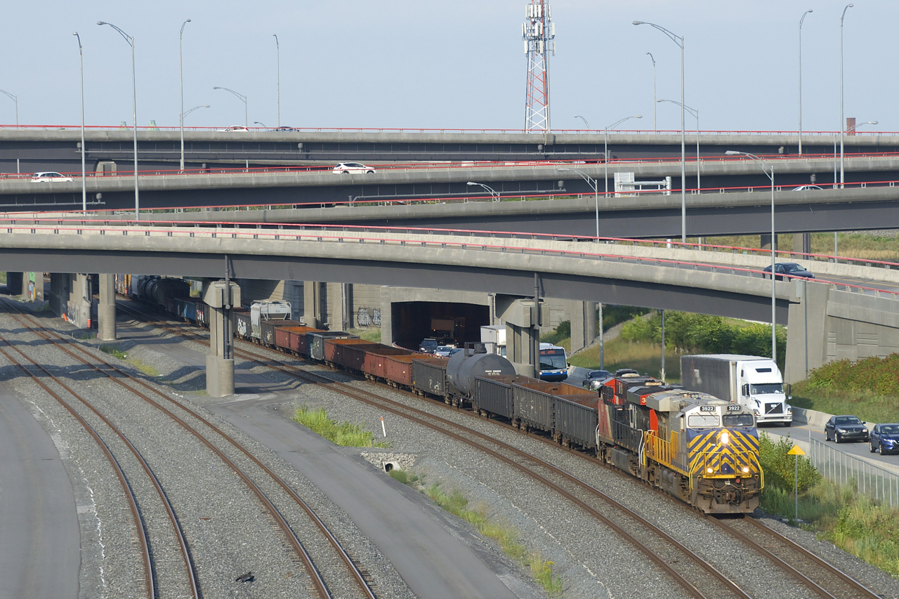 CN 321 has an ex-Citirail leader (CN 3922), along with CN 3838 & 121 cars as it emerges from the Turcot interchange during the evening rush hour.