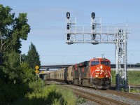 After being parked on the north track of CN's Montreal Sub for part of the night just slightly west of here, potash train CN B730 is on the move with a fresh crew. Power is CN 3904 & CN 2883 up front, CN 3932 mid-train and CN 3856 on the tail end