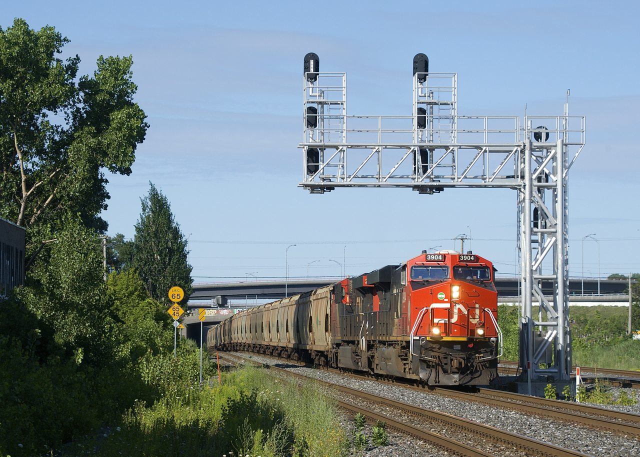 After being parked on the north track of CN's Montreal Sub for part of the night just slightly west of here, potash train CN B730 is on the move with a fresh crew. Power is CN 3904 & CN 2883 up front, CN 3932 mid-train and CN 3856 on the tail end
