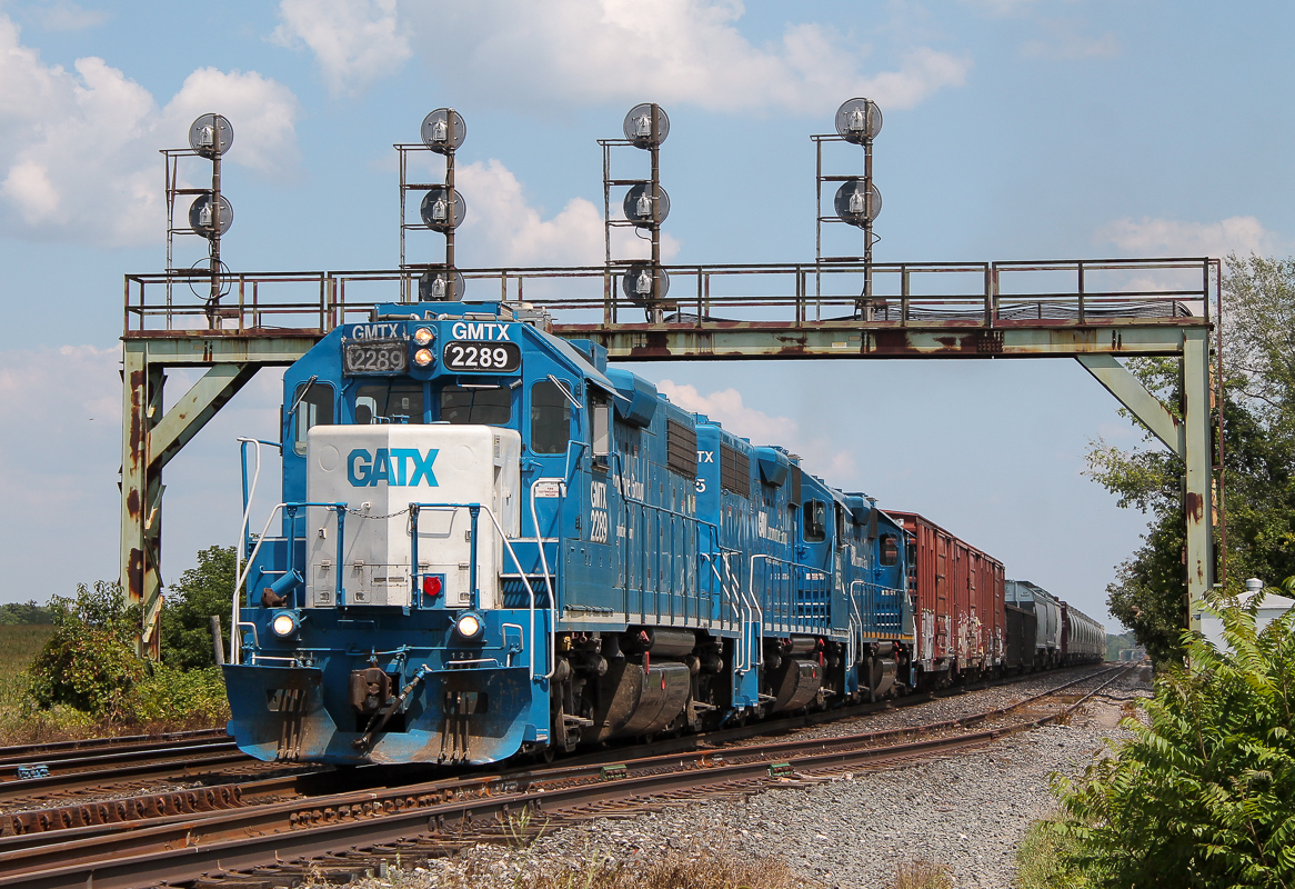 CN 583 departs Paris West with a trio of GMTX units.