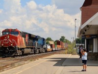 With word that 149 had a former CITI Rail in the lead east of Toronto, and I was already out with the boys for the morning, one way or another we were going to photograph it somewhere. Unfortunately I either was a day late or the power got swapped, LOL. Nevertheless this was a decent consolation prize as the blue GECX units are becoming very hard to find as most have been rebuilt. Here train 149 storms west past old and young railfans, giving a decent horn show possibly thanks to Christians hand signals :) The train is passing the old VIA/GO station at Georgetown as the cloud cover thickens on a very humid late summer day. 