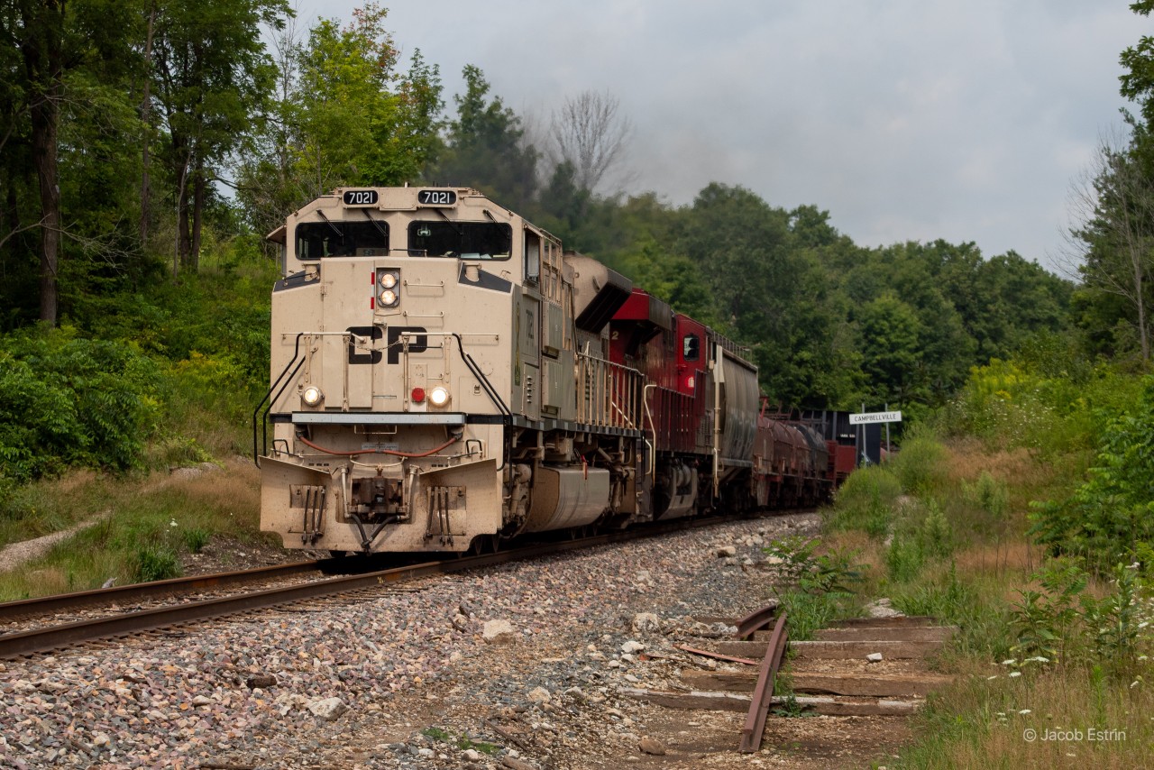 What a treat! CP Shortly after I began biking from my home to check out the power for 246-13 I heard over my scanner "CP 7021 West, 246's train looking for a light passed Scarlett for headroom", I quickly went back to my house and called up my buddy. We ended up racing it to Campbellville where we made it just in. Luckily we were able to catch it at multiple spots on the way down to Kinnear Yard where 247 had a meet with them. This is my third time catching 7021 lead, these military units don't seem to grow old on me!