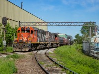 CN 4712 and CN 4762 lead a short 0700 Yard Job eastbound on the N&NW Spur.