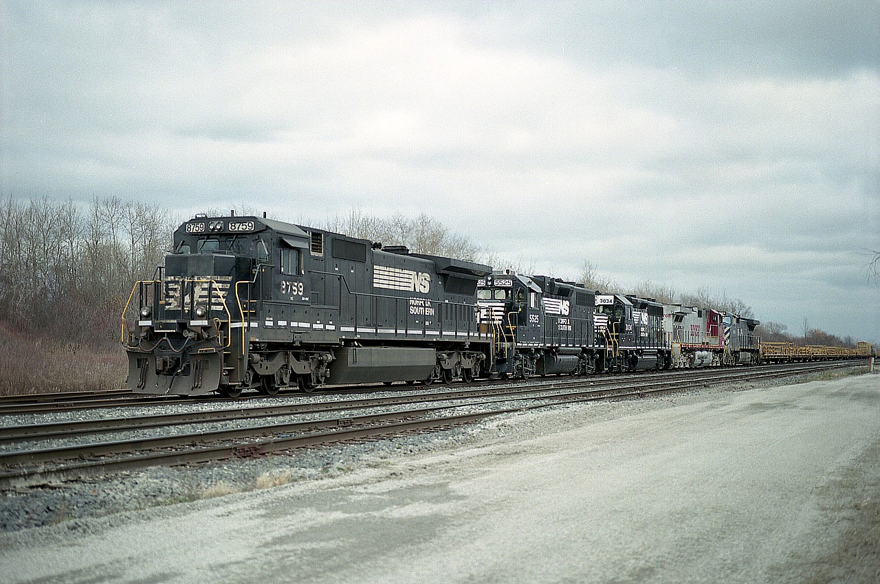 Over the recent years, the daily NS Buffalo to Fort Erie transfer has had a few surprises. An example was on this rather dull November day when I wandered down to check things out........probably on a day I had nothing better to do.
Power up front was NS 8759, 5525, 3034, BNSF 708 and CN (BCOL) 4649.  Made a nice change from the usual solid NS.  Photo is from the far west end of the yard,