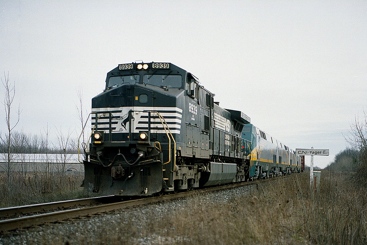 New locomotives for VIA!!  Hard to believe it has been only 20 years and it is rumoured these units will be on their way out as VIA finally gets more updated new power. NS 8939 has 4 units in tow, plus end buffer, as it heads up to Niagara Falls from the USA where these will be dropped at the sprawling CN yard.
The namesign "Yager East" is now history; the 1.2 mile connection here from the Stamford to the Humberstone sub was lifted some years ago; eliminating the "wye".
At the time I was always bemused by how the governments kept telling to "buy Canadian" yet they could not find anywhere in Canada to purchase a satisfactory locomotive....or anything else, for that matter.