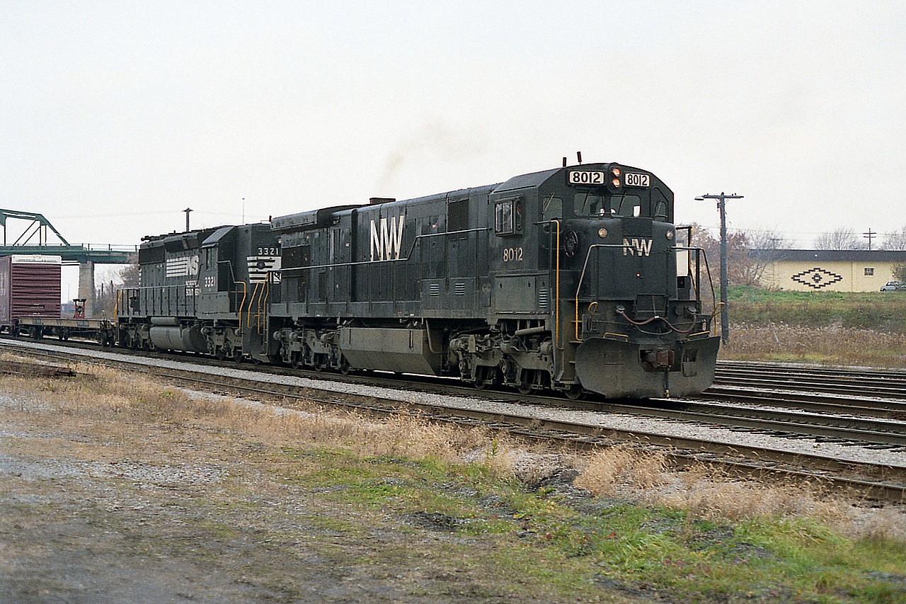 It has been quite a while since I have seen a locomotive lettered for the N&W in Fort Erie. In this view N&W 8012 is leading NS 2329 with what I must assume was a transfer heading for Buffalo.  The N&W C30-7 is one of 79 that were on the roster, 8003-8082,  and the last of the series was retired by 2001.  The Central Av bridge in the background is for ID purposes. :o)