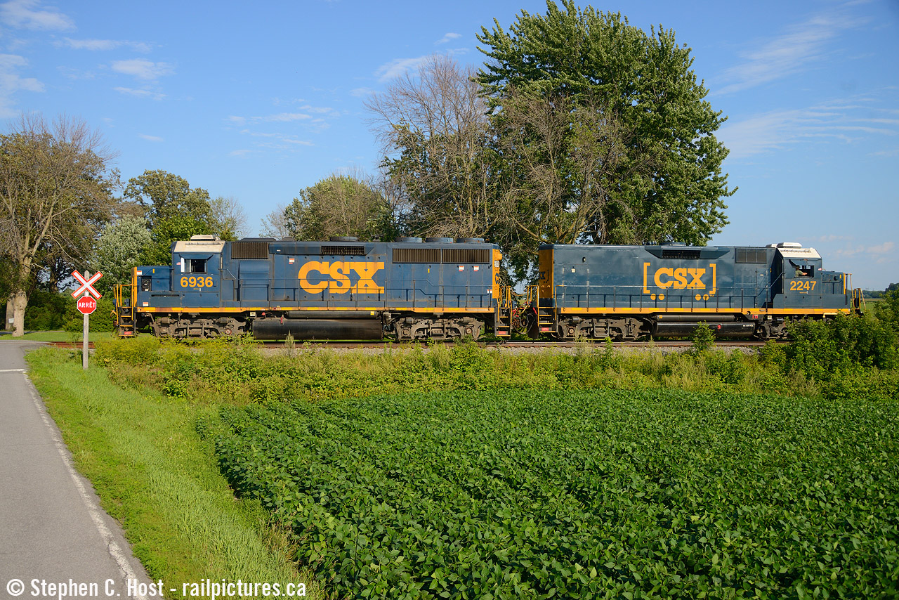 To the other end in the same month: I had a family trip to Montreal planned and with this operation high on my bucket list to get, and with very little time to try, I decided to just drive through the area on the way to downtown Montreal and got really really lucky. The french signs seem really out of place for CSX and I decided to place it in this soybean field as B786 headed to Huntingdon to lift some cars. I did not chase as I had no time for we had plans downtown, but this was a great capture to get on CSX's home rails.