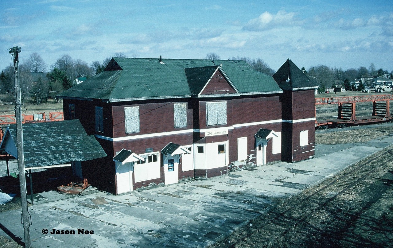 The last train to ever pause by the CN Palmerston station was unfortunately the CN rail train, seen here with its foreboding cars behind the town’s railway landmark. The stop was brief as the rail train was destined for the town of Harriston, which was located five miles north on the Owen Sound Subdivision. 

Thankfully, a few months later in June, 1996, the town had presented an offer to CN to purchase the station and adjoining railway property. It was also in 1996 when local volunteers started to organize a group and the funds to replace the aging leaking roof of the structure. By 1998, Palmerston was finally able to fully purchase the 26-acre yard from CN. 

Today, the station is home to the growing Palmerston Railway Heritage Museum, which has a decent collection of railway equipment as well as a detailed collection of local rail artifacts. This town has 100% done it right preserving their railway past and the museum is well worthy of a visit.