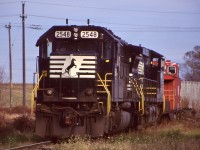 By the late 1990's Norfolk Southern's intermodal terminal in Dain City (near Welland) only had months left before closing. It was an interesting place, very compact as it was situated at the former Welland Junction, which vanished when the new Welland canal was built. The old main here was used to store NS power awaiting the next trip States side, as seen here with a SD70 and Dash-9. The NS caboose was a left over from when NS stopped using caboose on mainline trains in Canada, probably just months earlier. It wasn't long after CN turned the trackage here over to Trillium that NS pulled out as well. Today a translating facility is located here and all of NS' trains in Ontario are just a fading memory, with only a transfer job running between Buffalo and Fort Erie. 
