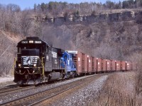One of the very few times I caught the NS train in Dundas. Here NS 327 is digging into the Niagara Escarpment as it passes the old station site in town, while the Escarpment fills the background. It was nice catching a soon to be retired ex Conrail four axle Dash-7 trailing this day. 
