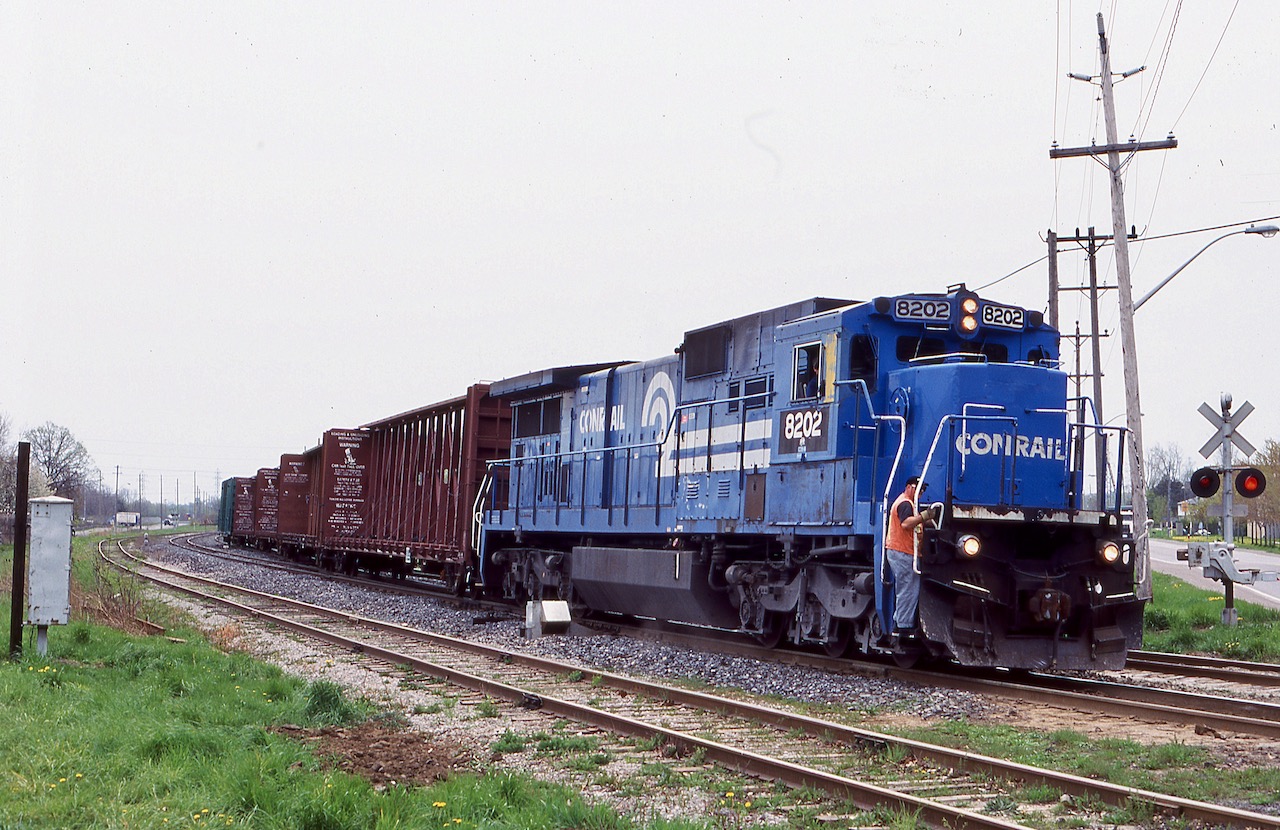It is almost hard to believe now that there was a time when railfanning around the Niagara Region could keep a Railfan busy all day, even Niagara Falls was still a busy railroad town. Back in 2002 CN Niagara Falls yard was still a busy place, not just for CN but NS run-through trains as well. While the stack trains to Dain City were history, NS still had through trains 327 / 328 and the NS Buffalo to Niagara Falls turn job 445. ON this day venerable former Conrail Dash-8 8202 was pulling off the Stamford sub. at Cliffton and about to back into the CN yard. Sadly today these old Dash-8's are long gone along with CN's yard in the "Falls". Today NS only runs as far as Fort Erie, and trains 327 / 328 are history as well.