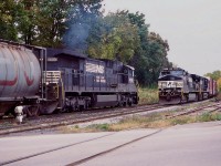 This day the stars aligned as it was the only time I caught two NS jobs on CN in Niagara. NS transfer job 445 out of Buffalo has just cleared the switch at Cliffton off the Stamford sub. and is beginning to back into CN Niagara Falls yard, while St. Thomas to Buffalo train 328 waits for it to clear and head onto Buffalo. By this time the NS C39-8's were nearing retirement.The 8566 started life as a N&W unit and was built to operated long hood forward.