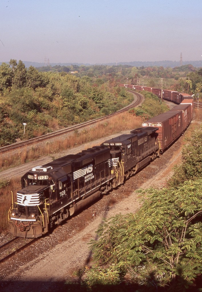 The NS GP60's were kind of neat, especially as I rarely caught one on this train. Here GP60 7128 works with a Dash-8 as they head along the cow path in Hamilton, and towards Buffalo. Today I believe most of the GP60's have lost their turbo chargers, as high horsepower four axle units never lived up to most railroads expectations.