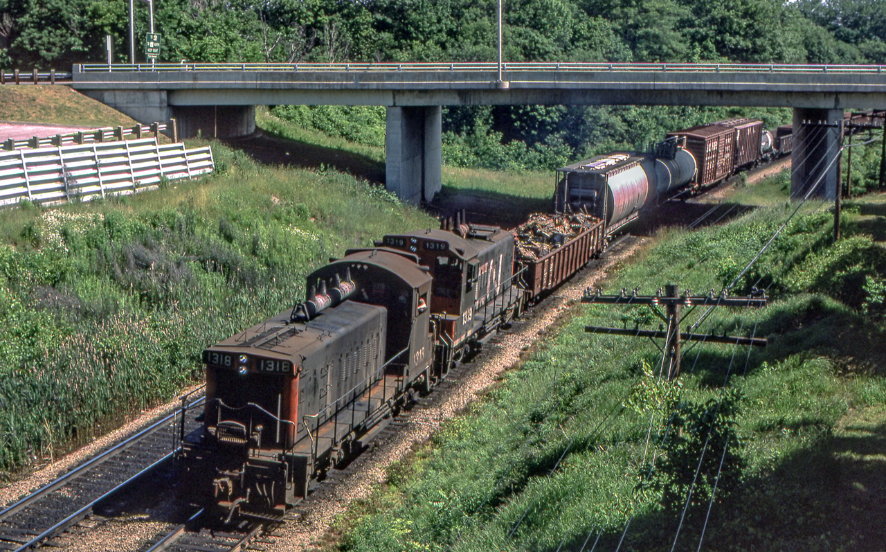 CN 1318 and CN 1319 are westbound approaching Bayview Junction, Ontario on July 21, 1980.