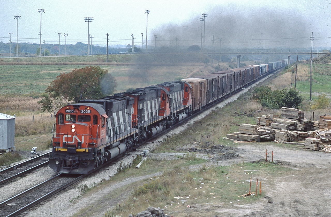 The days of ALCO spotting !


   Eastbound Century's storm through Whitby
 

   A matched set of MLW 1967 built C-630M's hustle an eastbound high priority.


   And not a G E in sight !  CN Extra 2035 East  at CN Whitby, October 9, 1984 Kodachrome by S.Danko


   Interesting: Life before the Double Stack.


   High Priority: note the Pacific Fruit Express controlled temperature reefers on the head end: higher priority than the CAST containers

 
   Circa 1984:  what  is  a  ' double stack ' ? 


   The independent shipper CAST containers was a major CN customer: On the verge of bankruptcy, in 1982 the Royal Bank and BMO provided a financial rescue package, then in 1985 CN exercised their option to obtain a 75% ownership of CAST.  On to 1995 the CAST Group in financial difficulty again, so CP Ships ( a subsidiary of Canadian Pacific Limited )  bought CAST,  then in 2005  the  German conglomerate TUI AG offered to acquire CP Ships Limited  for US$2.0 billion in cash, merging CP Ships with TUI's Hapag - Lloyd division.


   The C 630 model  was ALCO's response to the EMD SD45. The C-630M is the MLW built Century.


   Last call for the ALCO (designed)  Century


       ex CN 2035 in GEXR service 


   sdfourty