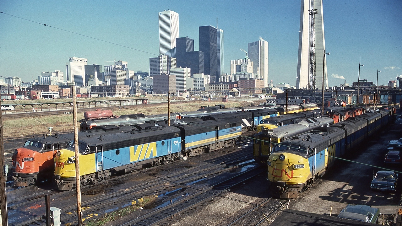 CN Spadina .....just can't get enough !


  Every day was variety day.


   And what to focus on ! 


   GMD FP9A  or GMD F9B  or  MLW FPA-4  or MLW FPB-4 or MLW RS-18m , or in various permutations: Budd Cars of your choice. 


   And the regular visitors: ONR FP7A


   Based on the nose livery, a sampling, from left:  CN 6531, VIA 6521, VIA 6865, VIA CN 6778,  ONR 1501, ONR 1509,  VIA 61XX, CN 3151, VIA CN 6537....


   At CN Spadina, November 4, 1978 Kodachrome by S.Danko
 

       visitors  


   comment: at that time the CN, was a ward of Your Federal Government, but nevertheless at that time CN had HEART, ...CN cared about customers and employees, and cared about the communities CN served, cared enough to fund and operate a mainline steam locomotive program...a fan could walk into the office sign a release grab a hard hat and away you went...not certain any of that can be said today....except one thing is certain CN cares about today's shareholders....hello Mr. Bill Gates....


   sdfourty