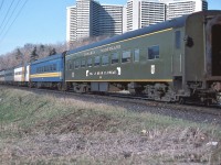 <br>
<br>
   It's the Northland ! 
<br>
<br>
   Southbound at 07:45, after 545 miles, with only 6 miles to Toronto Union Depot, the towers of Thorncliffe Park provide a backdrop for Via CN pool train #98
<br>
<br>
   powered by ONR's classic  FP7-A #1521 and #1501, coupled in the normal Northland lashup: 'elephant style'.
<br>
<br>
   ONR coach #832 built 1941 by Pullman as N&W #1752 , was acquired 1971 ( just prior to Amtrak) 
<br>
<br>
   at CN Bala sub mile 6,  April 23 1977 Kodachrome by S.Danko. 
<br>
<br>
     <a href="http://www.railpictures.ca/?attachment_id=  7278">  #98 classic power  </a>
<br>
<br>
  interesting
<br>
<br>
   the sleeper – second car - is one of two CN stainless steel sleepers (CN had 4 SS sleepers in the roster): either 1190 Green Gables or 1191 Greenock, acquired from BAR in 1965: 80 North Twin Lake / 81 South Twin Lake. The identifying feature is the double lavatory windows. Green Gables / Greenock had 6 roomettes – 6 section – 4 double bedroom. 