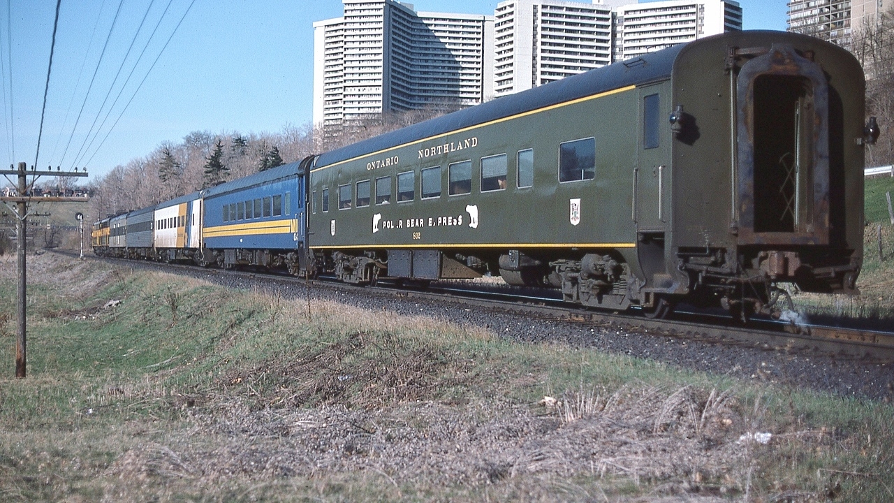 It's the Northland ! 


   Southbound at 07:45, after 545 miles, with only 6 miles to Toronto Union Depot, the towers of Thorncliffe Park provide a backdrop for Via CN pool train #98


   powered by ONR's classic  FP7-A #1521 and #1501, coupled in the normal Northland lashup: 'elephant style'.


   ONR coach #832 built 1941 by Pullman as N&W #1752 , was acquired 1971 ( just prior to Amtrak) 


   at CN Bala sub mile 6,  April 23 1977 Kodachrome by S.Danko. 


       #98 classic power  


  interesting


   the sleeper – second car - is one of two CN stainless steel sleepers (CN had 4 SS sleepers in the roster): either 1190 Green Gables or 1191 Greenock, acquired from BAR in 1965: 80 North Twin Lake / 81 South Twin Lake. The identifying feature is the double lavatory windows. Green Gables / Greenock had 6 roomettes – 6 section – 4 double bedroom.