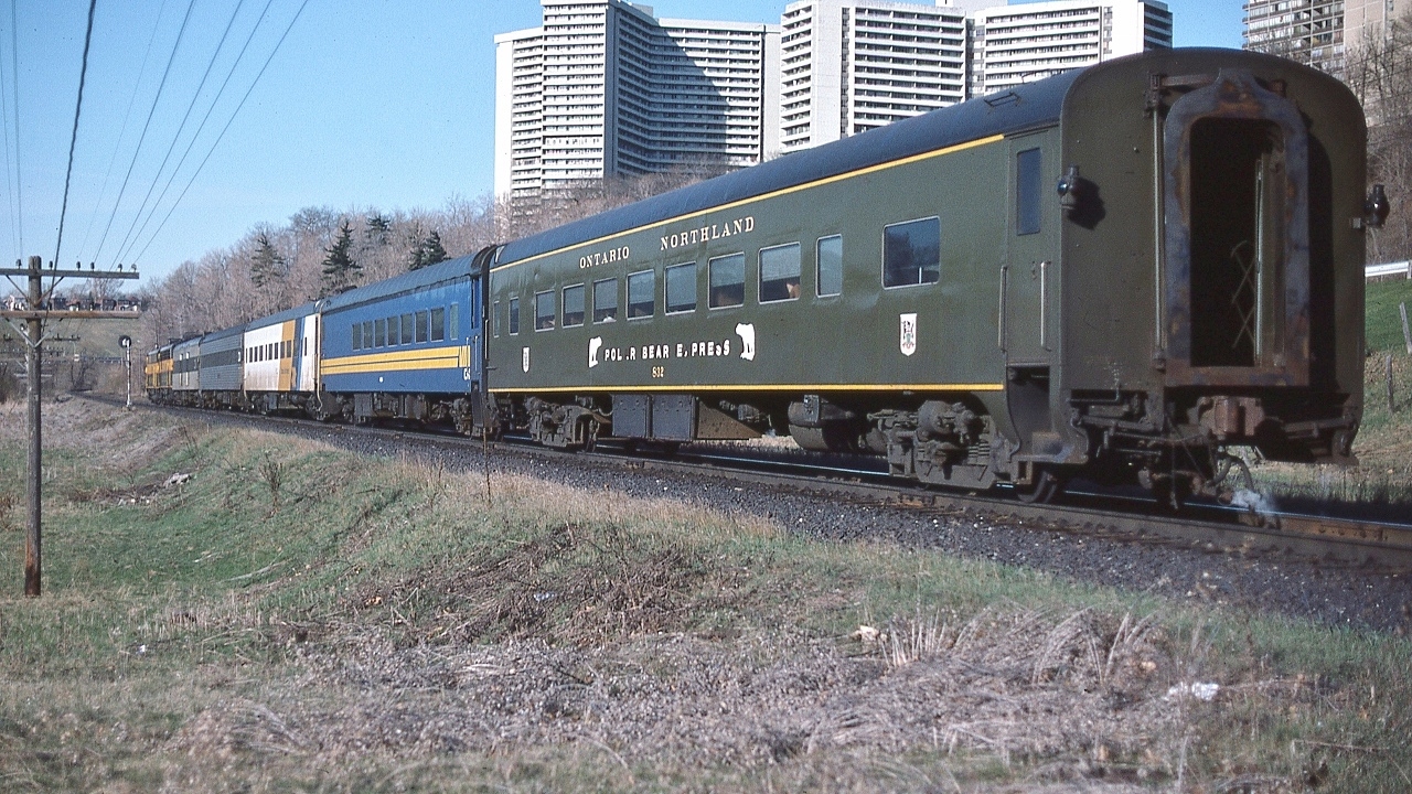 It's the Northland ! 


   Southbound at 07:45, after 545 miles, with only 6 miles to Toronto Union Depot, the towers of Thorncliffe Park provide a backdrop for Via CN pool train #98


   powered by ONR's classic  FP7-A #1521 and #1501, coupled in the normal Northland lashup: 'elephant style'.


   ONR coach #832 built 1941 by Pullman as N&W #1752 , was acquired 1971 ( just prior to Amtrak) 


   at CN Bala sub mile 6,  April 23 1977 Kodachrome by S.Danko. 


       #98 classic power  


  interesting


   the sleeper – second car - is one of two CN stainless steel sleepers (CN had 4 SS sleepers in the roster): either 1190 Green Gables or 1191 Greenock, acquired from BAR in 1965: 80 North Twin Lake / 81 South Twin Lake. The identifying feature is the double lavatory windows. Green Gables / Greenock had 6 roomettes – 6 section – 4 double bedroom.