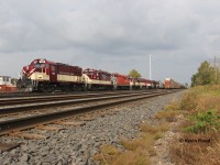 On September 24, 2020, CN was in charge of taking OSR (Ontario Southland Railway) equipment (locomotives and cars) from the Guelph Jct. Railway operations out of Campbellville (Guelph Jct.) to their shops in Salford, ON via the Guelph Sub. Over the summer of 2020, OSR equipment was purged from the Campbellville shops and sent up to Guelph, including some ex-BCR MLWs which would go to Quebec. August 28, 2020 was the last day of OSR running on the Guelph Jct. Railway; GEXR would take over the lines after that date. Since I was busy to get the movement between Guelph and Kitchener in the morning that day, I was hoping to catch up with the train west of Kitchener on its way to London. However, the train had some issues and the crew tied it down in Kitchener Yard. Definitely not the most photogenic location, but for me, it's either get fussy about location and don't shoot the train or get a shot of it. I opted for the latter because it was an interesting train to say the least.