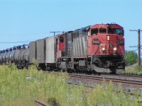 A CN eastbound led by CN 2413 is pictured rolling through Paris Jct. in August, 2006.