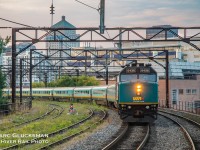 <b>Heading to Halifax!</b> F40PH-2 6438 leads the REI-weekly VIA Rail Canada Train 14 (Ocean) is departing Gare Central in Montreal, QC heading to Halifax, NS on the evening of Friday, August 24, 2018. The “Renaissance Class” cars were built by Metropolitan-Cammell in 1995-1996, and number 139 in the VIA fleet. The towers used to carry catenary for Canadian National before it was cut back to Gare Central.


