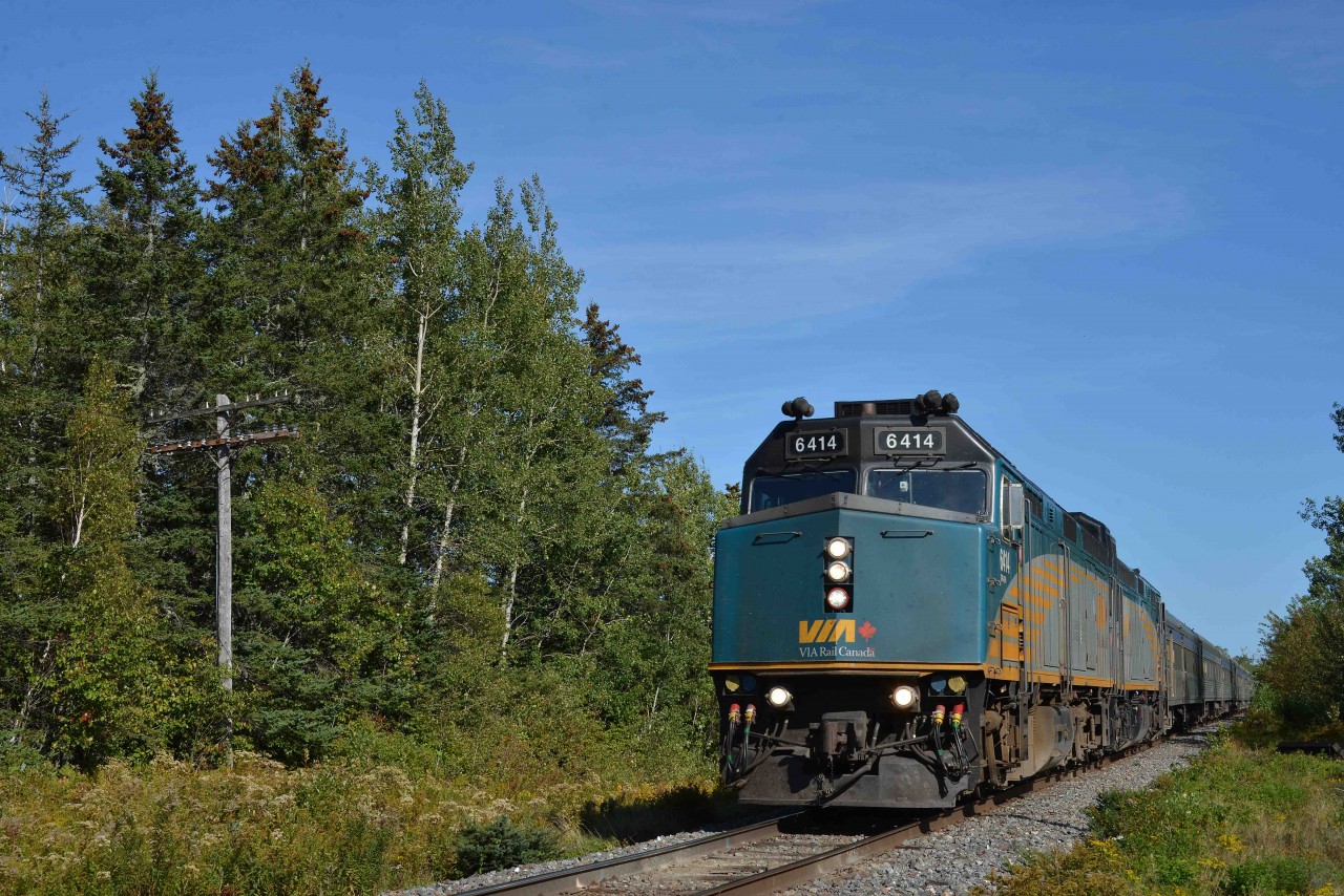 VIA Train 15 approaches Westchester, Nova Scotia, Mileage 33.3 of CN's Springhill Subdivision at 3.23 p.m. on Wednesday, September 22, 2021.  There's only an hour left in the summer of 2021 and Covid restrictions have reduced the service to but once a week.  As well, the back-to-back 'F40s' and lack of a Park or Skyline dome car confirm that VIA trains are no longer turned in Halifax prior to returning to Montreal.