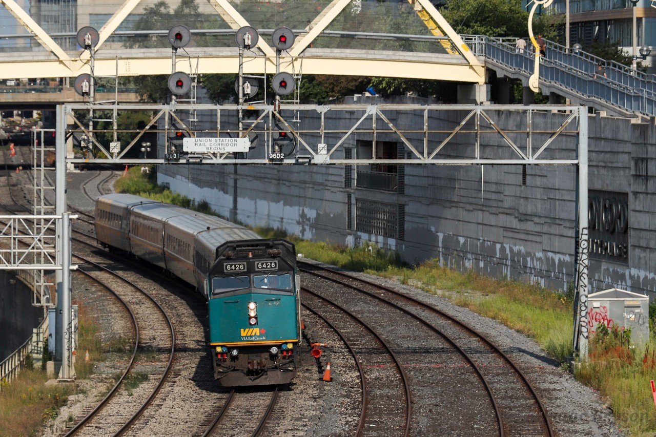 VIA 6426 leads a pack of LRC coaches as VIA 53s equipment move exists the Union Station Rail Corridor (USRC) en route to TMC where it will wait for its next assignment. The focus of this shot was the searchlight signals that are still on full display. As TTR brings cantilever after signal bridge full of new signals into the USRC, who knows how much longer these searchlights will last.
