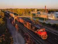 CN 399 catches the last of the suns rays on a lovely fall evening at Paris Junction.