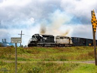 The Stallion (1741) and The Ghost (1740) just after clearing the North Cautionary Limit in Englehart throttle up to a cloud of smoke headed Northbound on 213 to Cochrane.<br><br>
North Cautionary Limit - Englehart Yard - September 6