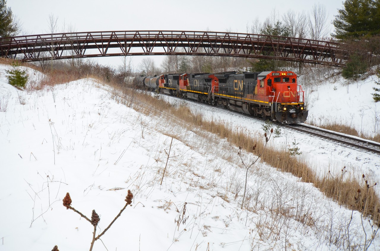 Just as a good snow storm started to roll in, CN 570 wastes no time up the Halton Sub passing under the Glencairn Golf Club bridge at Mile 30 with a very short train of Aldershot traffic in tow. Early 2021 when this was taken, CN was at the start of phasing out the Dash 8’s from the roster so this leader here had quite the attention as it stayed on this train for quite awhile leading in the same position most of the time. I’m not sure what the state of this unit is now but if anyone knows feel free to say.