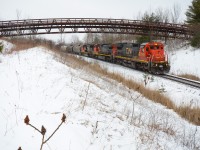 Just as a good snow storm started to roll in, CN 570 wastes no time up the Halton Sub passing under the Glencairn Golf Club bridge at Mile 30 with a very short train of Aldershot traffic in tow. Early 2021 when this was taken, CN was at the start of phasing out the Dash 8’s from the roster so this leader here had quite the attention as it stayed on this train for quite awhile leading in the same position most of the time. I’m not sure what the state of this unit is now but if anyone knows feel free to say. 