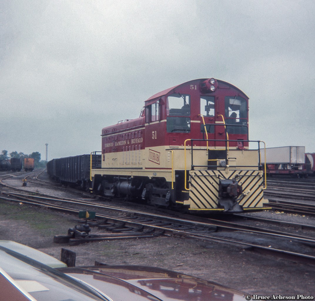 TH&B NW2u 51, built by EMD in 1947, rests at Aberdeen Yard with a cut of gondolas.  Today 51 is part of the Ontario Southland Railway's fleet and rests at their Salford shop.
