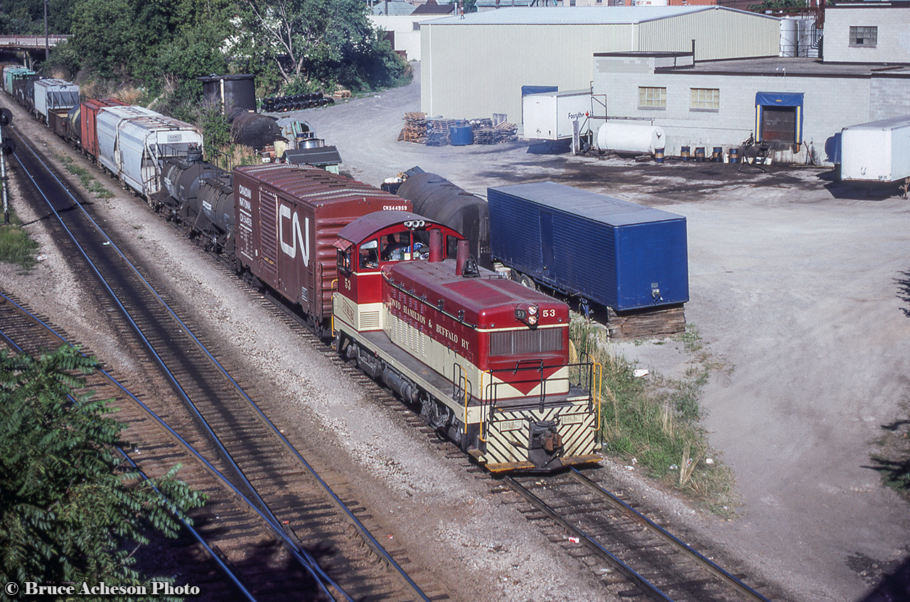 TH&B 53 leads a cut of cars underneath the Chatham Street overpass and towards Aberdeen Yard.