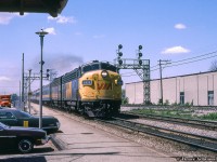 VIA Rail FP9A 6520 and a B unit sister bring eastbound number 72 into Burlington West station.  Built as <a href=http://www.railpictures.ca/?attachment_id=34912>CN 6520</a> in March of 1957, the unit would be transferred to VIA 6520 in March 1978, renumbered to <a href=http://www.railpictures.ca/?attachment_id=45636>VIA 6306</a> in June 1984 and finally retired from VIA service in 1994.  It would serve for three years with Les Trains Touristiques du Saint-Laurent (TTSL 6303) until May 1997, when it would move to Ontario as <a href=http://www.trainweb.org/oldtimetrains/tourist/WSJR_6520.jpg>Waterloo-St. Jacob's Railway 6520.</a>  After languishing in Toronto until 2012, it would finally make it's way west to the West Coast Railway Association's site in Squamish, British Columbia, where it was recently restored to <a href=http://www.railpictures.ca/?attachment_id=42767>CN's 1961 scheme.</a>