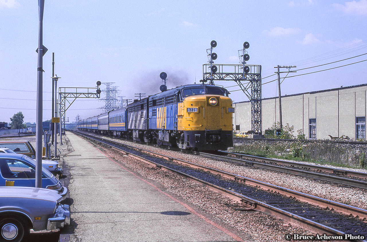 VIA train 72 behind an A-B set of MLW power rumbles by Burlington West with a hint of MLW smoke.