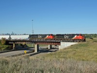 Z 11451 13 eases over the Yellowhead Trail, with the Edmonton Skyline in the distance