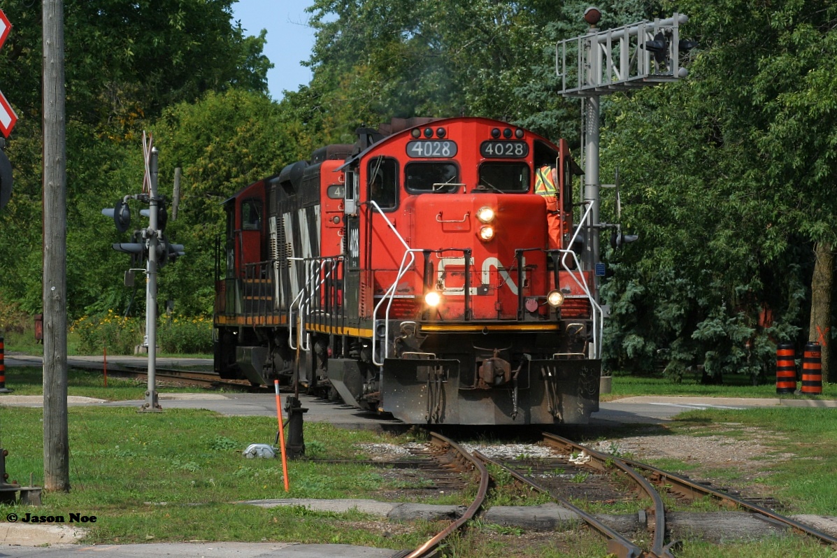 In a scene that could pass for two decades earlier, CN L568 returns to XV yard in Guelph crossing Edinburgh Road light power with GP9RM’s 4028 and 4116. CN L568 was returning after setting-off several boxcars at the WestRock of Canada facility on the North Industrial Spur in Guelph.