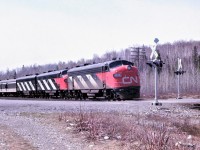The Panorama, CN train 105 with 6511 6524 6616 for power slows to enter the passing track at Milnet, Ontario for a meet with train 2 the Super Continental.  The lead unit 6511 was added at Capreol.  It had arrived the previous night on 106 which explains the dirt on the unit compared to the other two units which were freshly washed in Montreal prior to heading west. The combined Toronto and Montreal sections required a third unit west of Capreol.