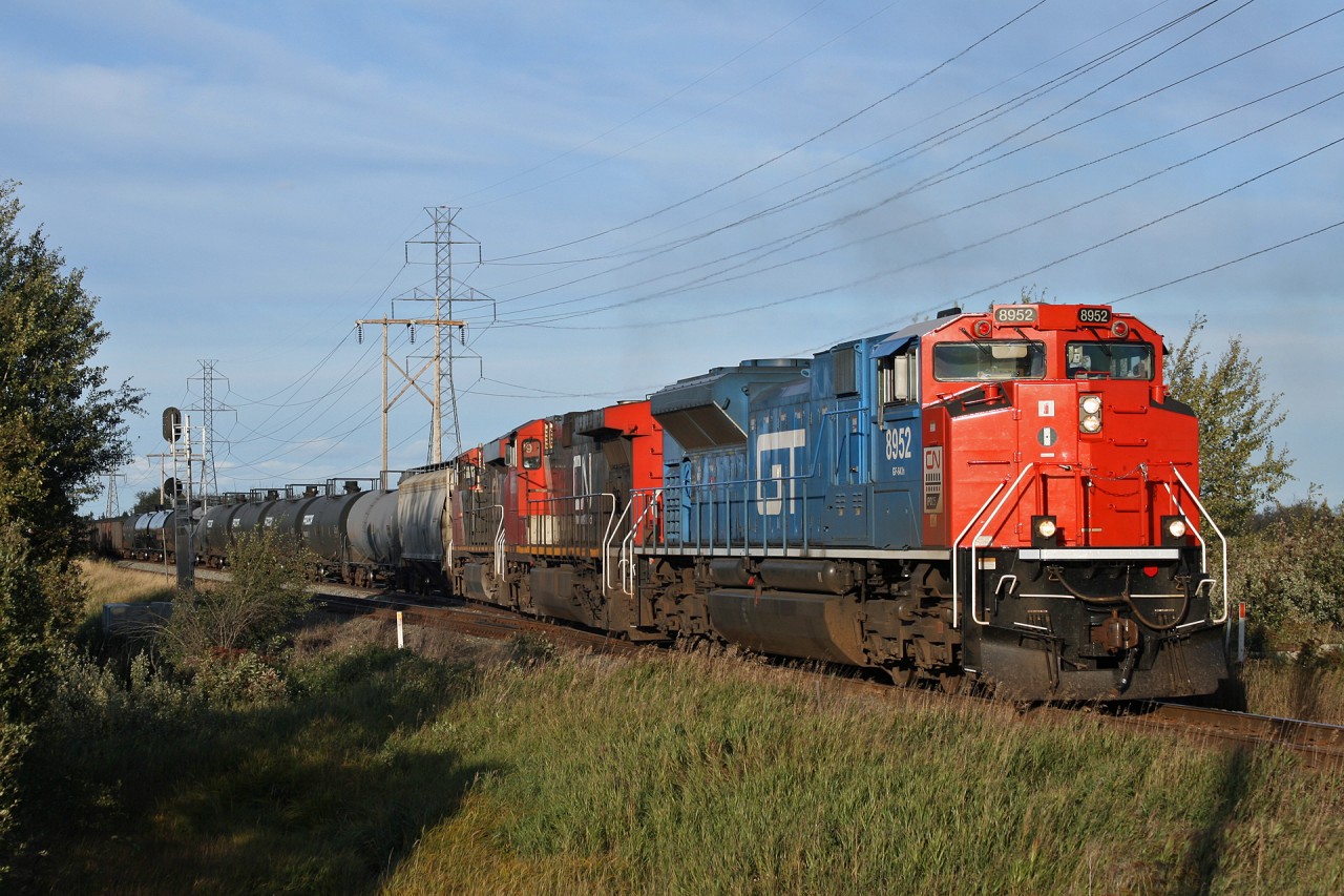 CN L 53852 16: CN 8952, CN 2666, CN 2279 departs the siding at Nashman with 108 cars for Walker Yard.