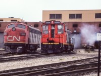 Could not resist taking a picture of this pair. The 9151 is parked for whatever reason. The 1508 has its stacks capped, I believe it has just arrived. Possibly waiting to be setup to go to work. It did work the City yard downtown for awhile. The 5362 has just been started and is about to go into the shop. Taken on the east side of the shops, using Ektachrome film.