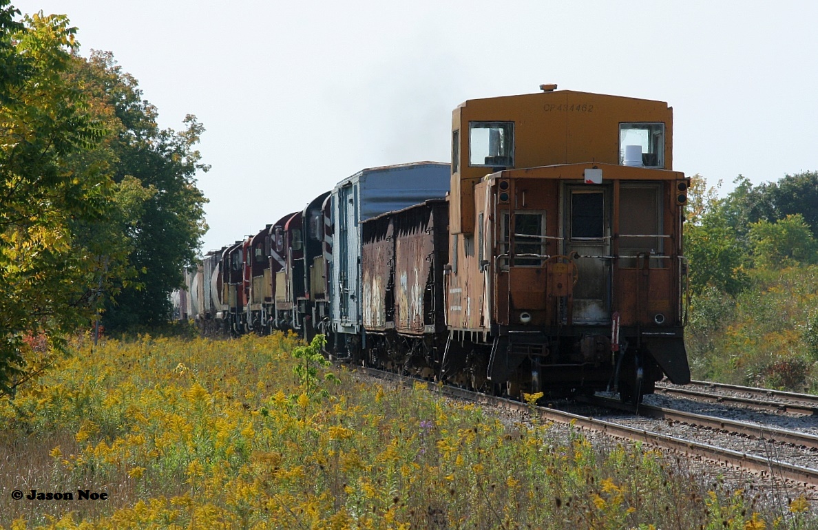 On the second leg of its journey to St. Thomas, Ontario Southland Railway’s units, MofW cars and caboose were placed on the tail-end of CN L568 between Kitchener and Stratford. It’s been a long time since any caboose has travelled on the end of a train on the CN Guelph Subdivision and maybe the first time a former CP caboose has been put on the tail-end of a CN train over the line. Former CP van 434462 is seen on the rear-end of CN L568 as it passes through Baden heading west to Stratford.