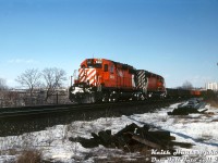 CP SD40-2 units 5912 and 5723, two of CP's fleet of hundreds of SD40-2 units that GMD London had been churning out for CP since 1972, head a westbound extra freight near Don Mills, seen here at Mile 203.4 of the Belleville Sub after crossing the trestle over CN's Bala Sub and about to cross over the Don Valley Parkway bridge. Apparently there were some CP detours down the CN Bala Sub on this date, but this doesn't appear to have been one of them. <br><br> <i>Keith Hansen photo, Dan Dell'Unto collection slide.</i>