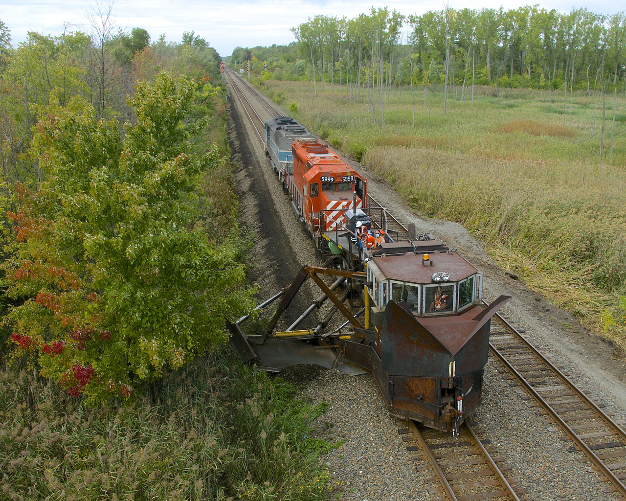 Work 5999 with CP 5999 and CMQ 9020 is spreading along the south track of the Adirondack Sub with spreader CP 402898.