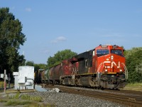 CN 527 has CP 8827 trailing CN 3251 as it advances past CN St-Henri. Sonn it will back its Pointe St-Charles lift onto the rest of its train before departing westwards. Up front are 5 MGLX cars.