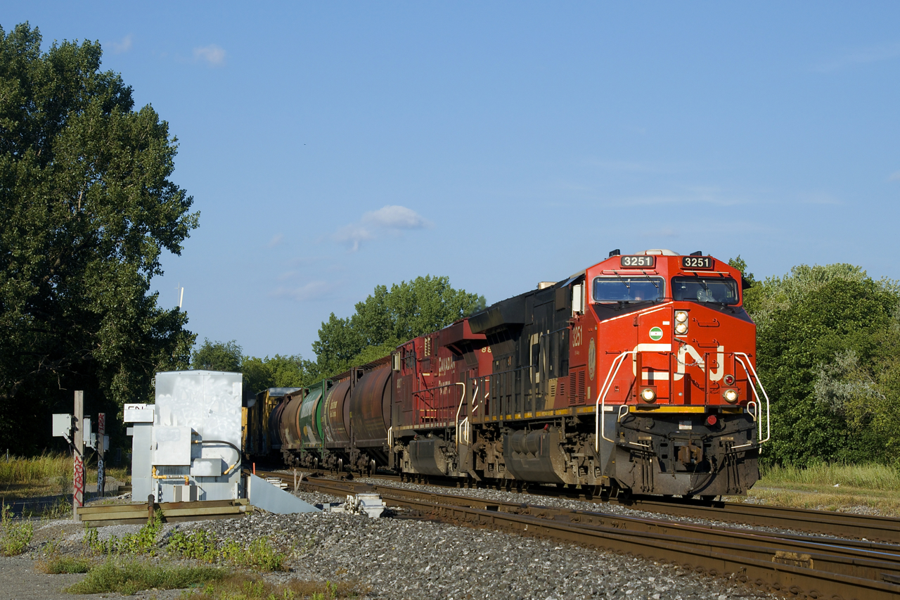 CN 527 has CP 8827 trailing CN 3251 as it advances past CN St-Henri. Sonn it will back its Pointe St-Charles lift onto the rest of its train before departing westwards. Up front are 5 MGLX cars.