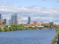 ES44AC's in two paint schemes are on the head end (CN 3874 & ex-CREX CN 3935) as potash train CN B730 crosses the Lachine Canal.